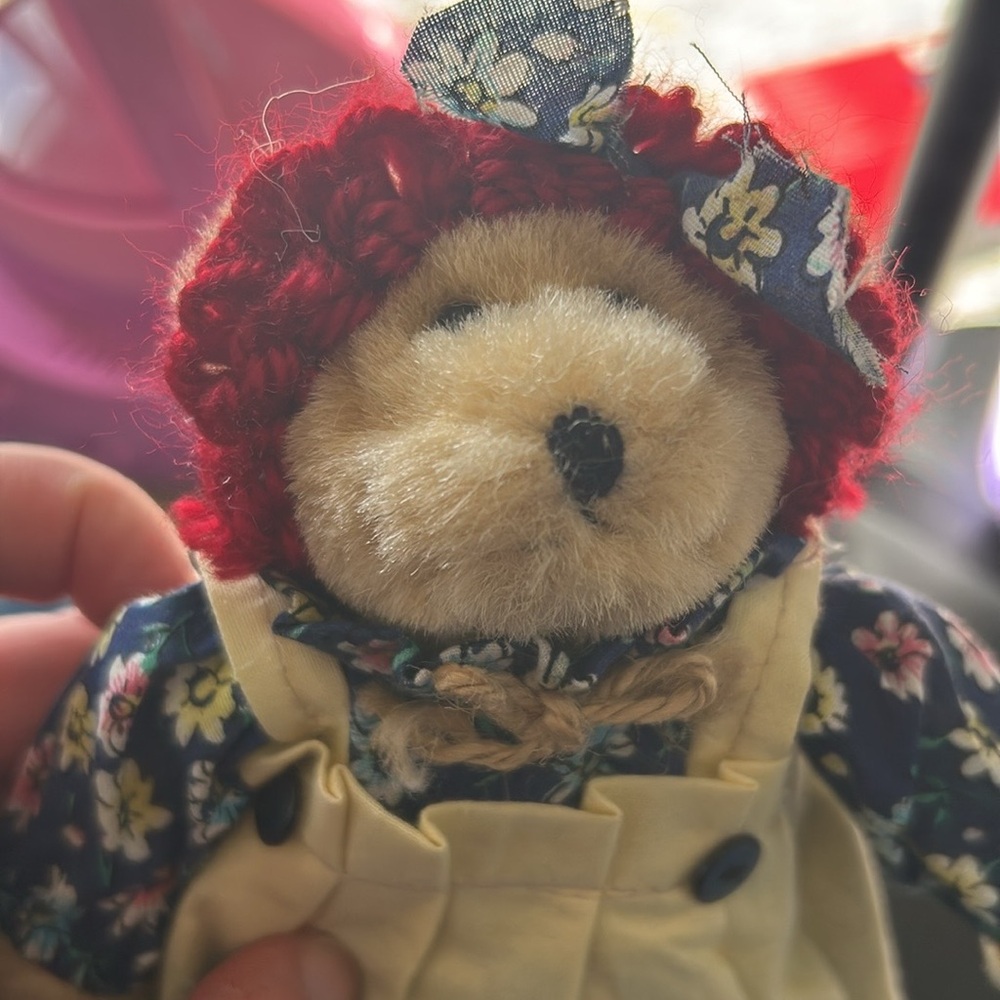 1999 Springford Bear with blue floral dress and white pinafore, red headband